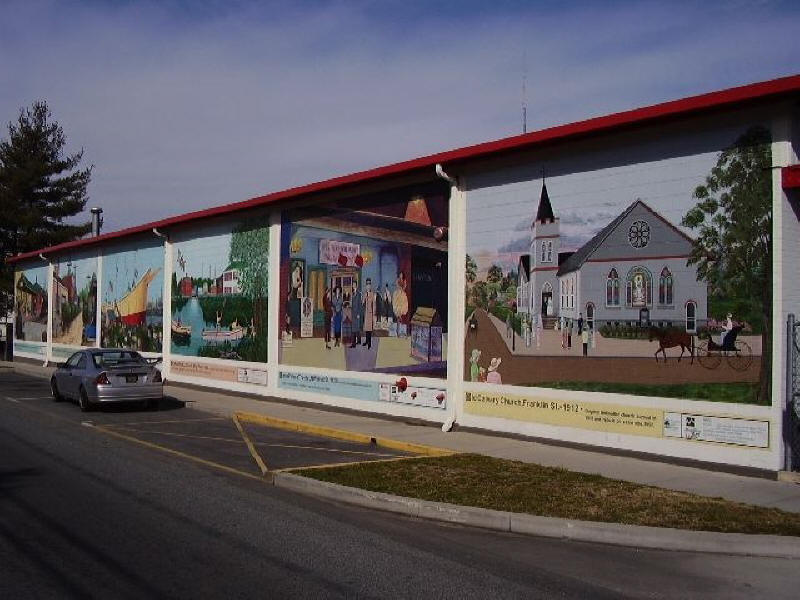Milford mural by Mispillion Art League. showing town scenes