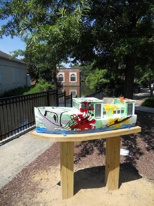 Downtown Milford's Art on the Riverwalk Tour ship deptiting community