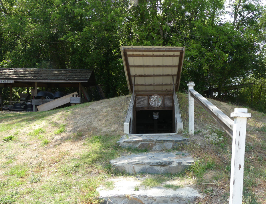 root cellar with gristmill in background at Old McCaskill Farm