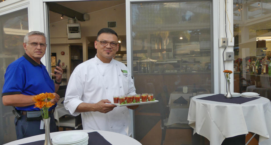 Chef Gerry holding Bloody Marys and maintance manager at Dinahs Poolside Restaurant in Palo Alto , CA