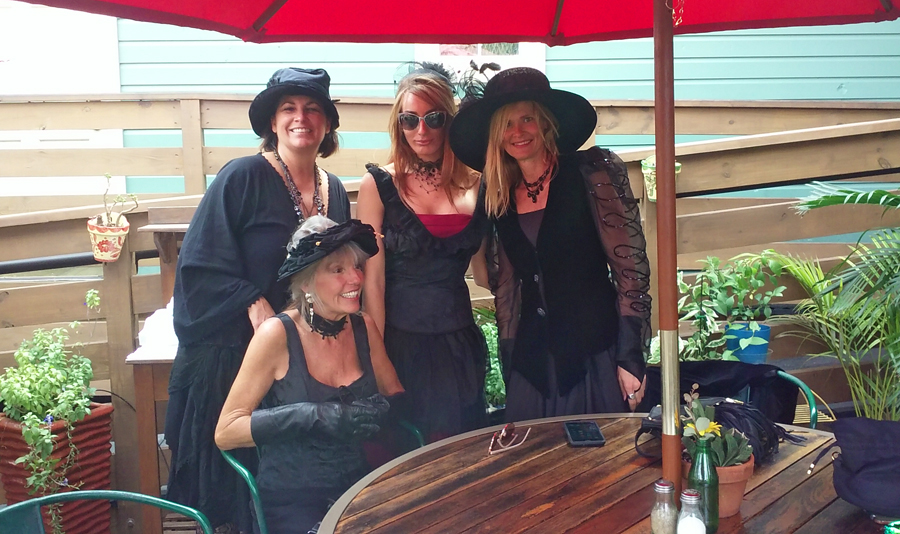 four women dressed as witches