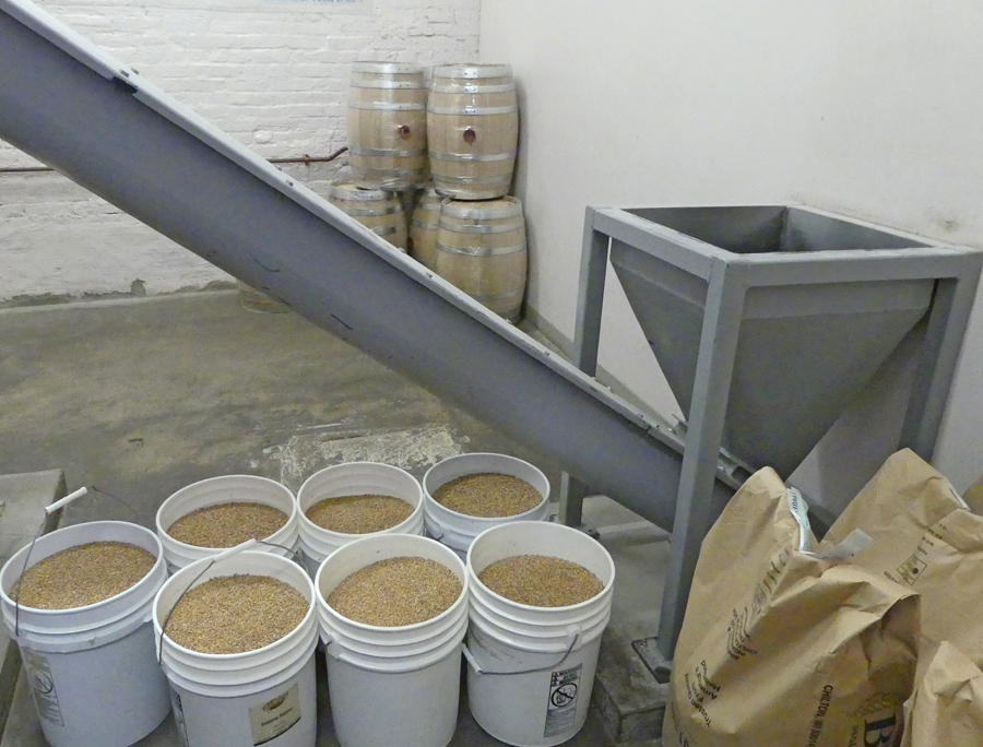 Buckets of grain waiting processign at Wigle Whiskey in Pittsburgh