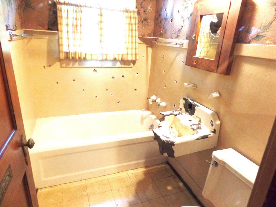 bathroom with bulletholes at Little bohemia where john dillinger stayed