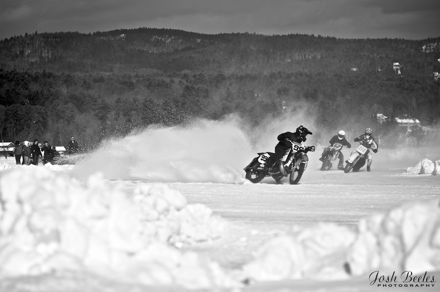 Motorcycles race over ice on Lake George