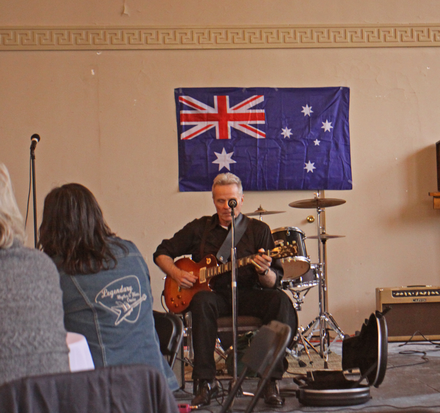 Preston Rumbaugh playing guitar at Welcome Home Aussie Party