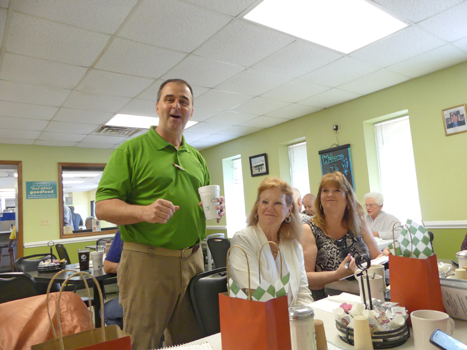 Owner serving customers at Lovick's Restaurant in Kinston