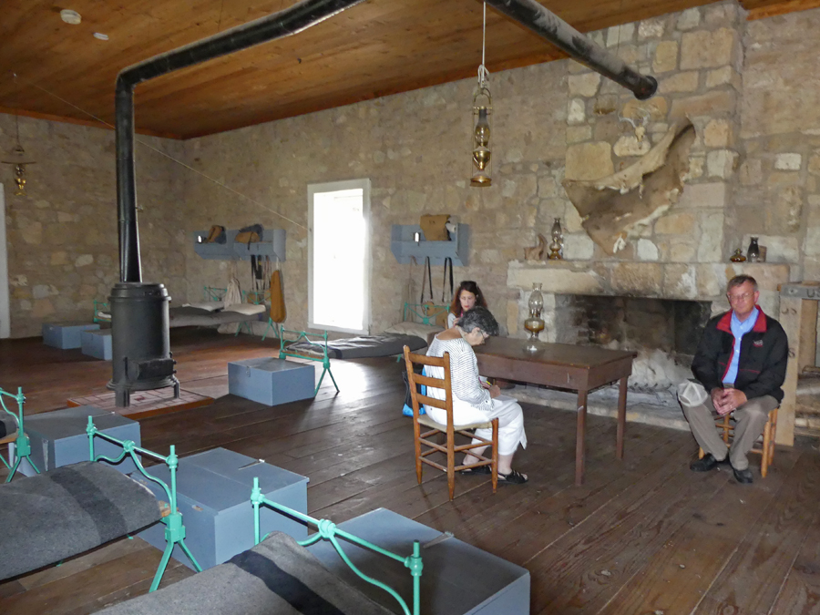Bob Bluthardt explains the furnishings of a barracks at Fort Concho
