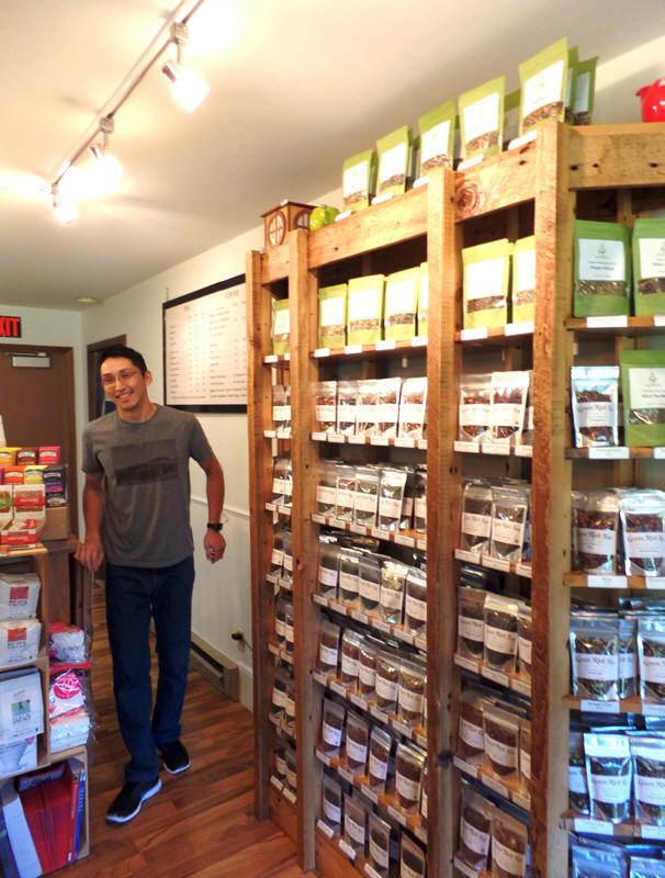 Clerk behind counter at Green Rich Tea  in wisconsin