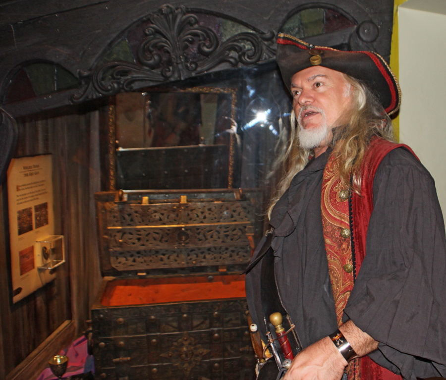 Pirate displays authentic pirate chest at Pirate Museum  in St. Augustine, FL