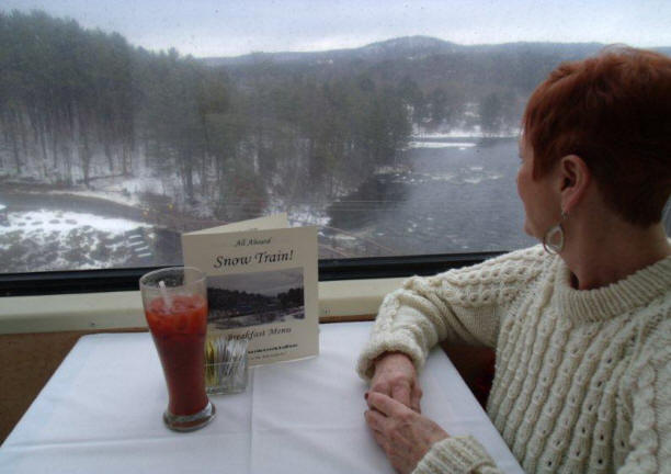 passenger enjpying breakfast on the snow train