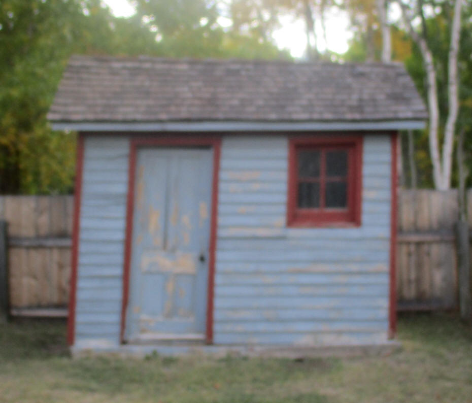 an outhouse with windows