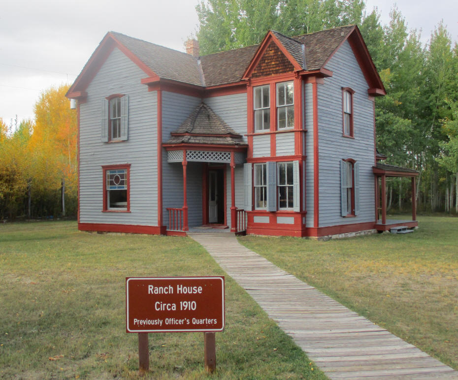 gray victorian house wiht red trim