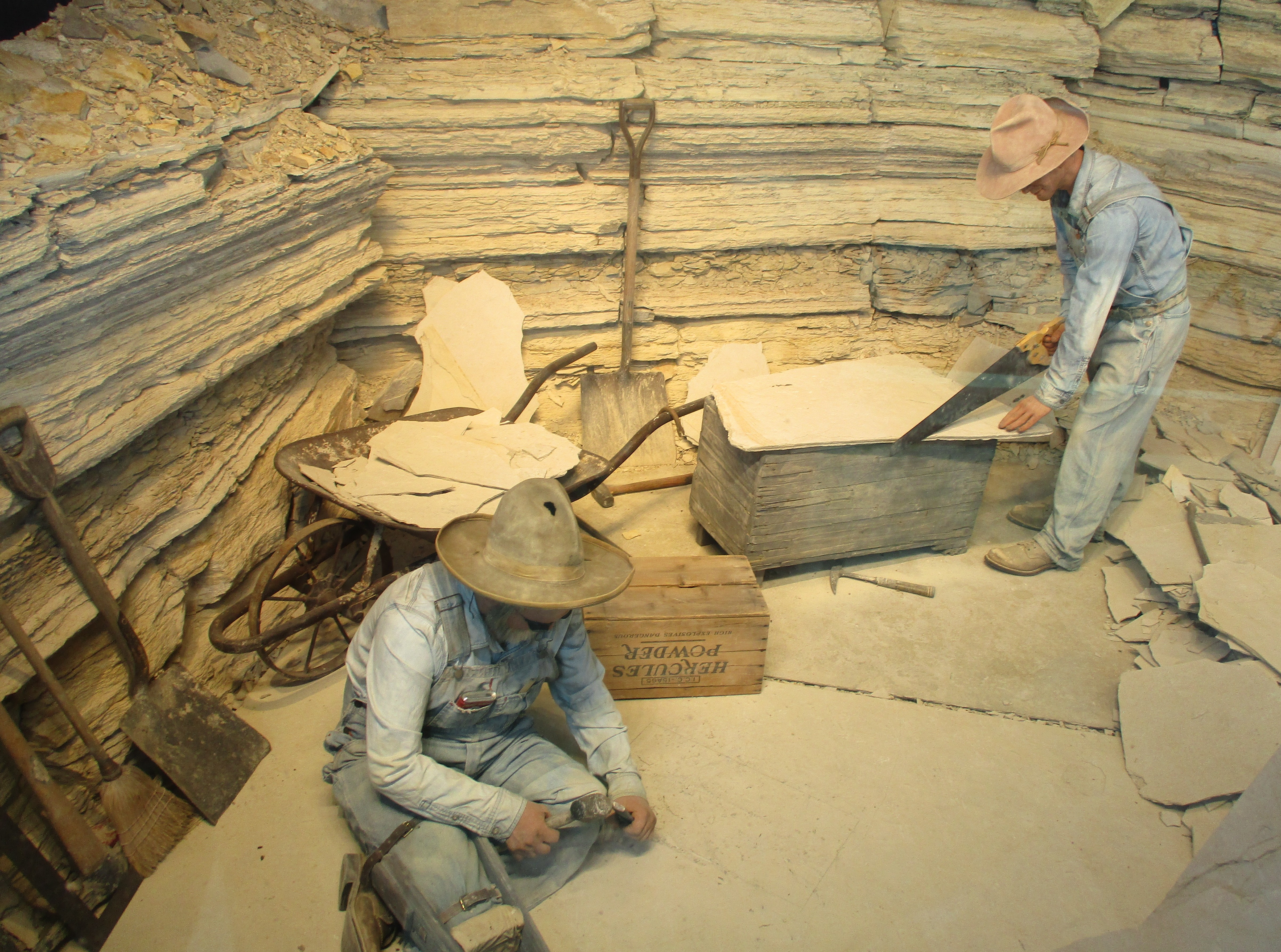 Men working with chisel and saw