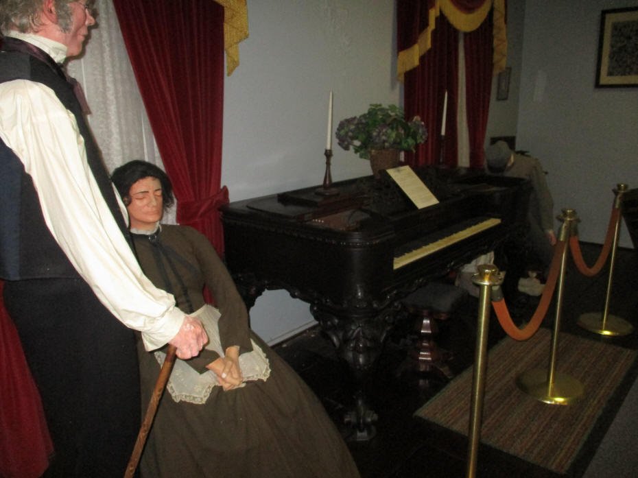 proplr in Civil War era clothing at piano