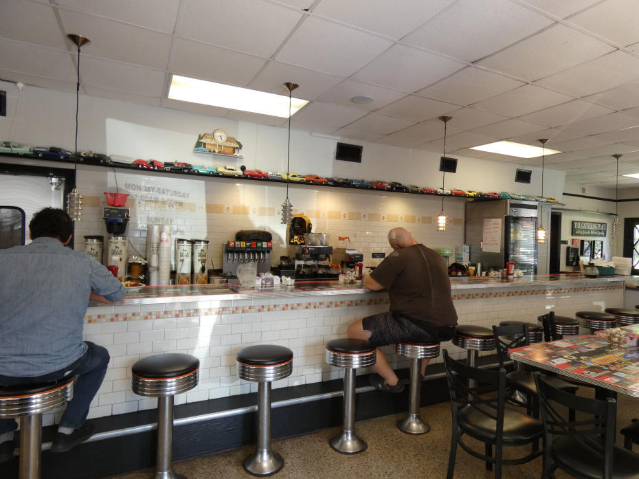 customers eating at restaurant counter