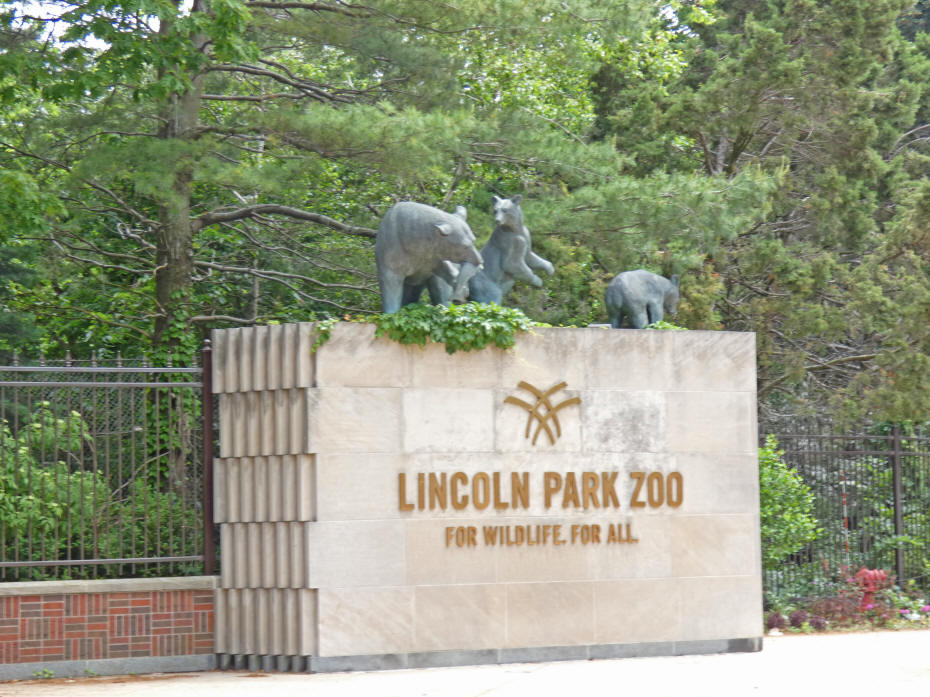 sculpture at entrance of three bears playing