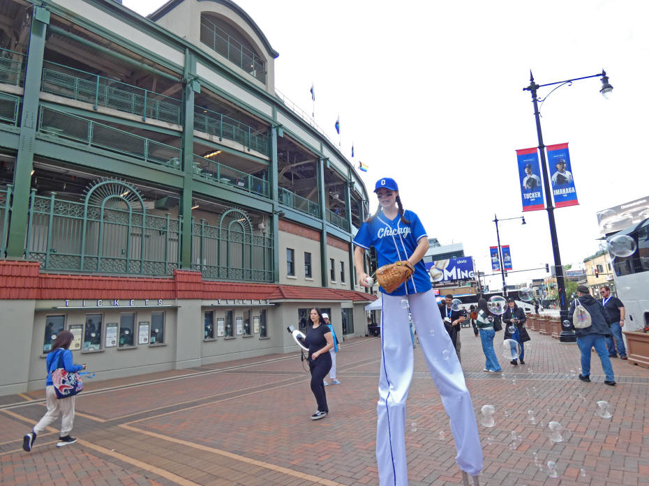 stilt walker pitching balls