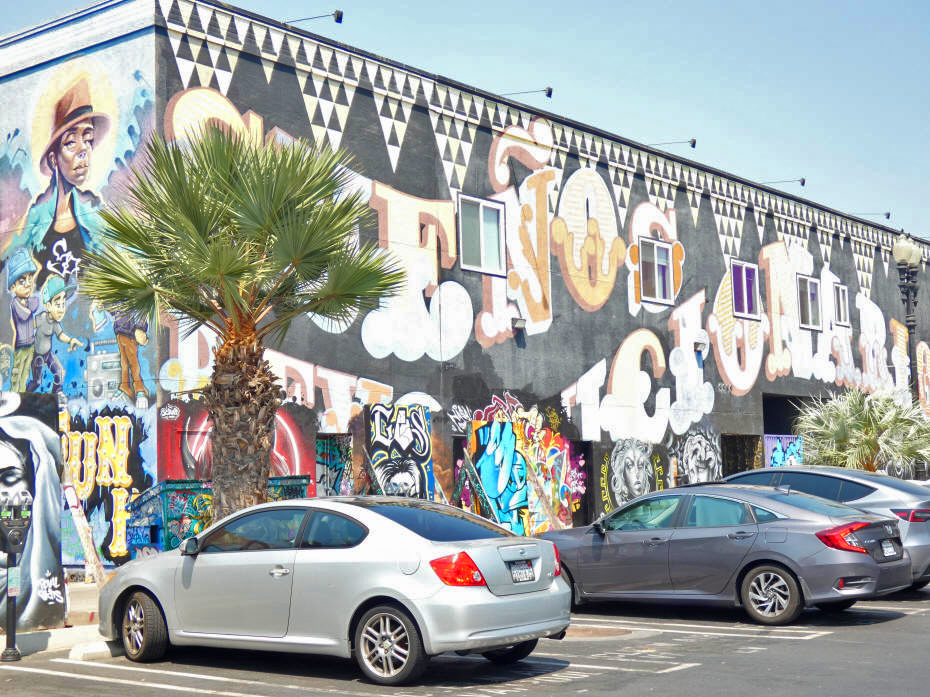 Building with two murals downtown 