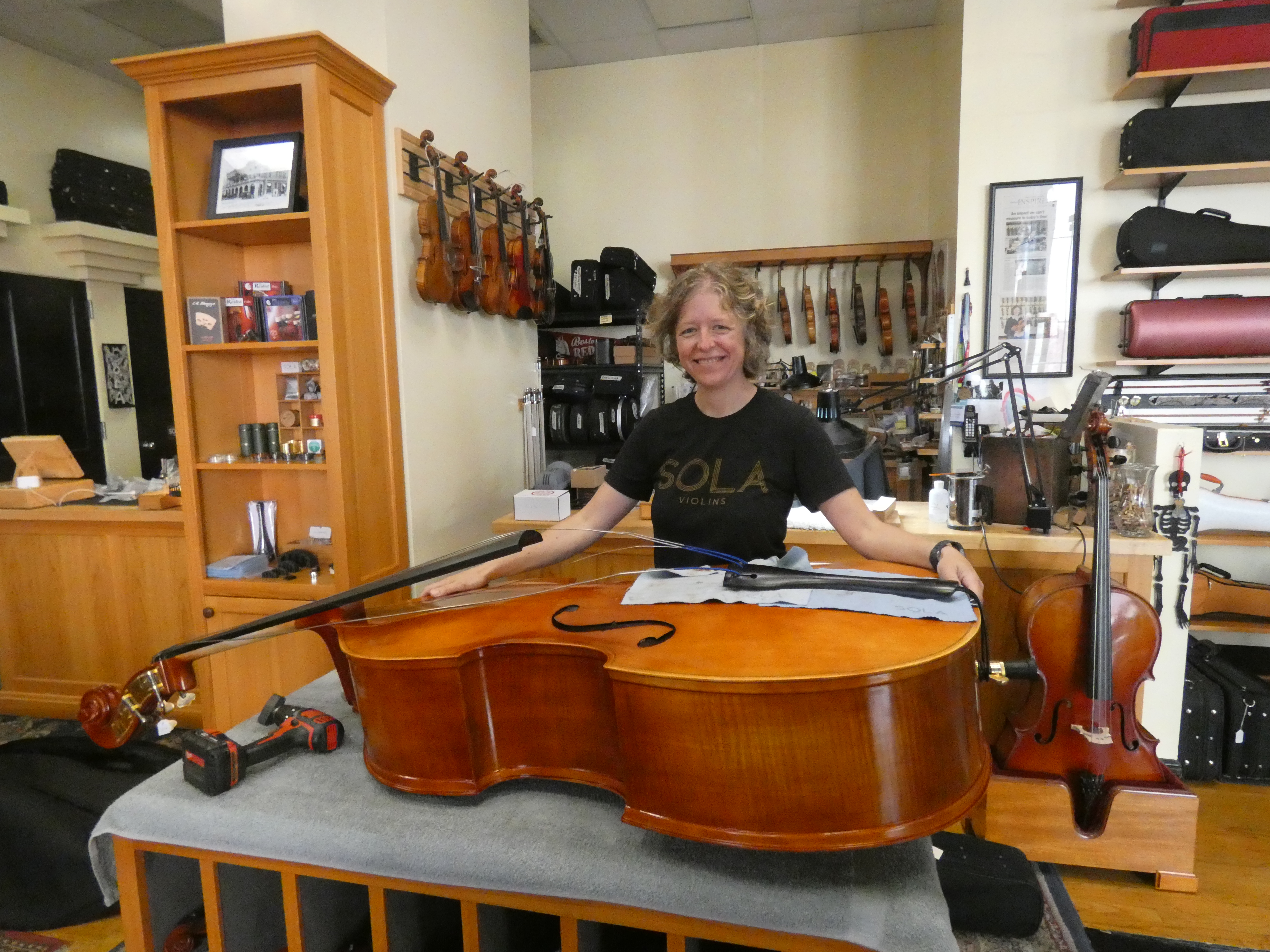 woman in front of bass fiddle