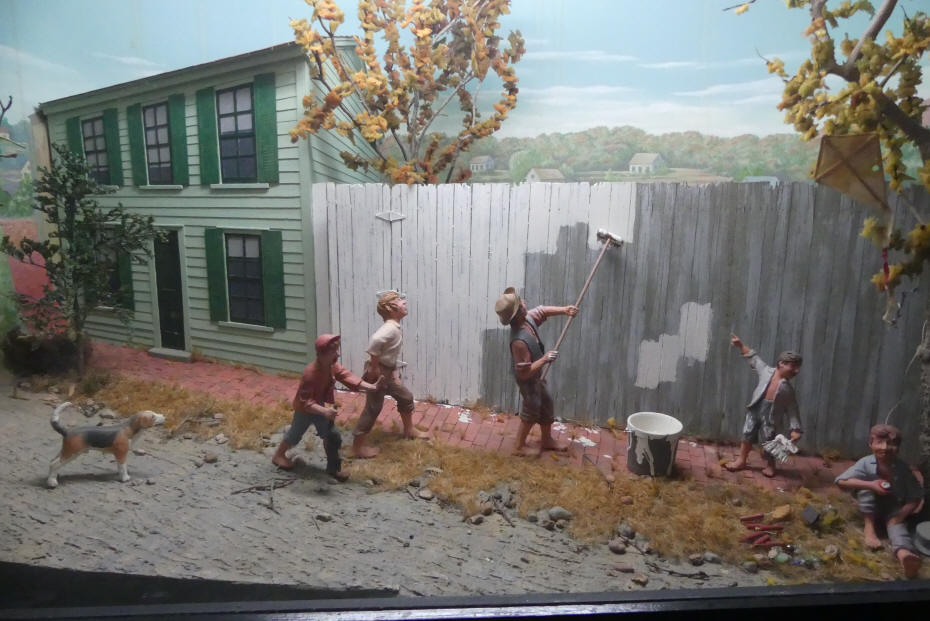 Diarama of Tom Sawyer fence painting