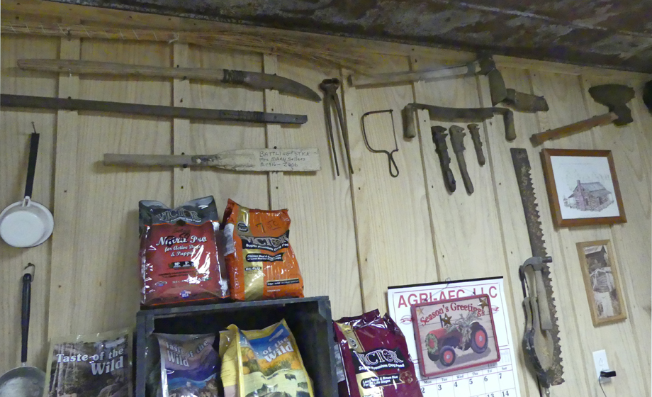 Joe's grandfather's cane striper and other tools on the office wall at Todd Syrup Farm