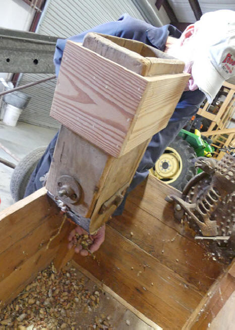 Joe working old fashioned peanut sheller  at Todd Syrup Farm