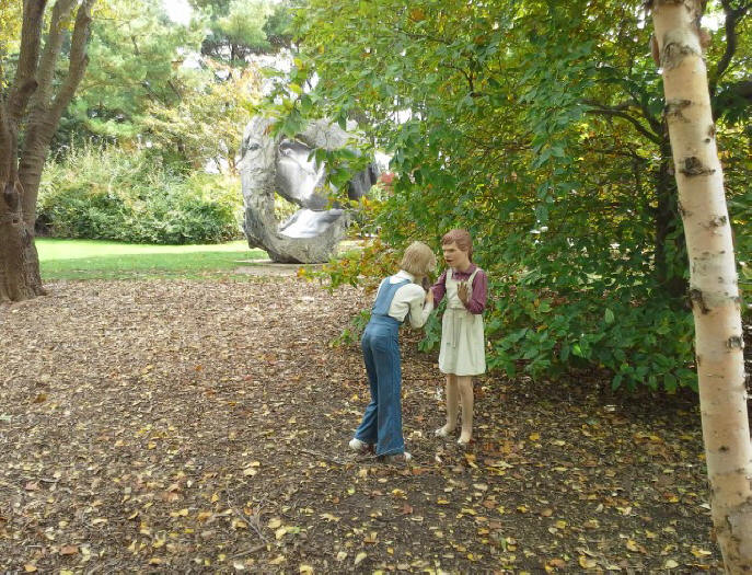 sculpture of two teenaged girls arguring at Grounds for Sculpture near Trenton, N.J.