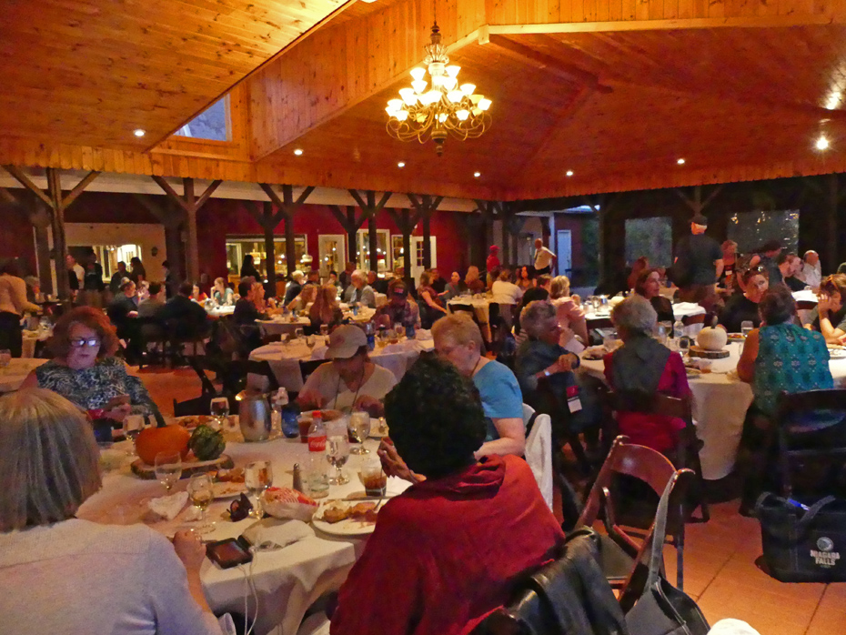 Large group of peopel eating dinner at Becker Farms