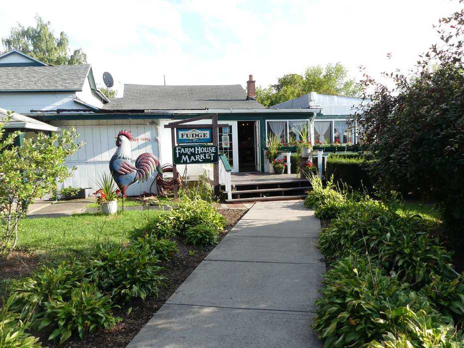 Shop with large chicken  stature outside at Becker Farms