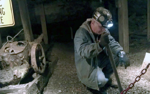 Miner displayus mine work inside a mine in Berkley's Exibition Mine