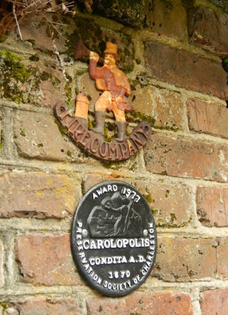 charleston architectural award on red brick wall