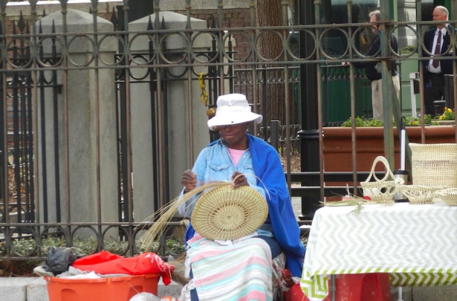 Gullah woman weaving a basket