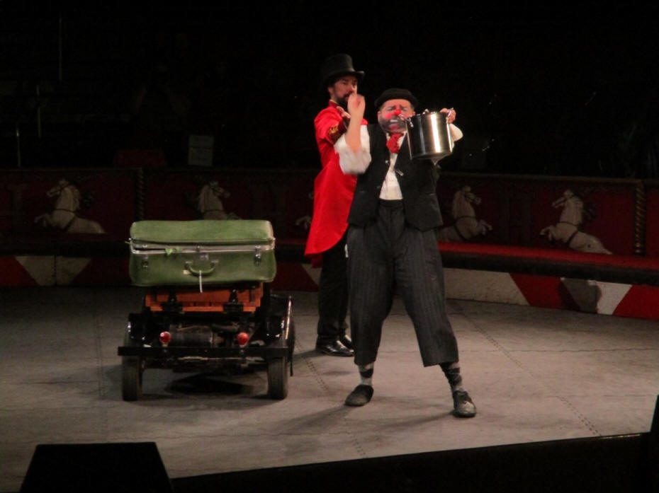 circus preformers in ring with tiny car 