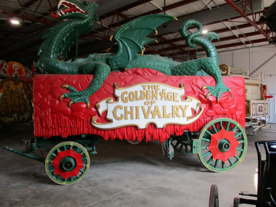 red wagon with green dragon atop 