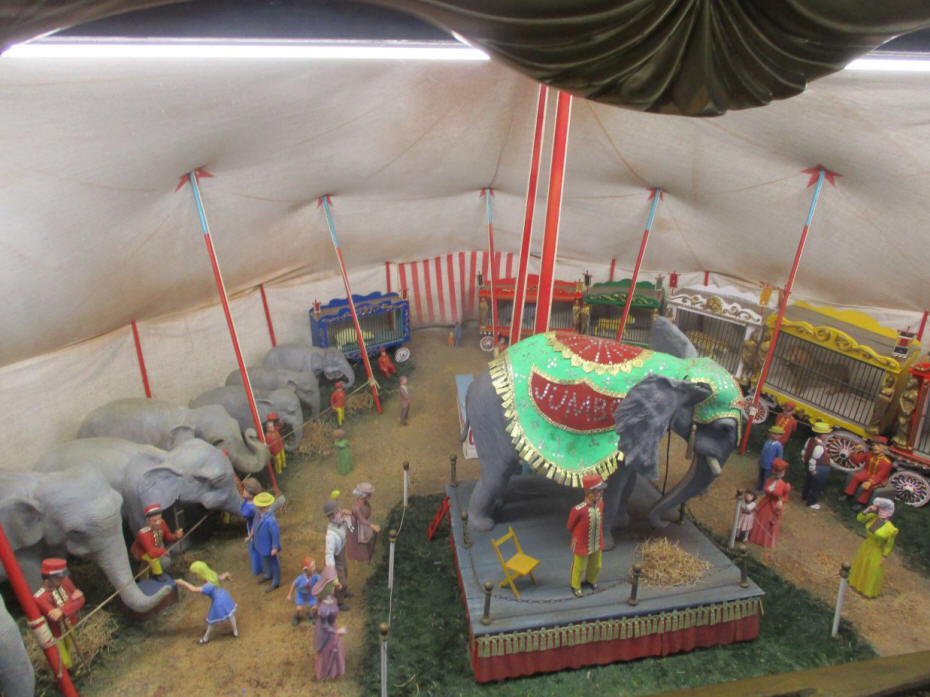 people admiring a group of elephans