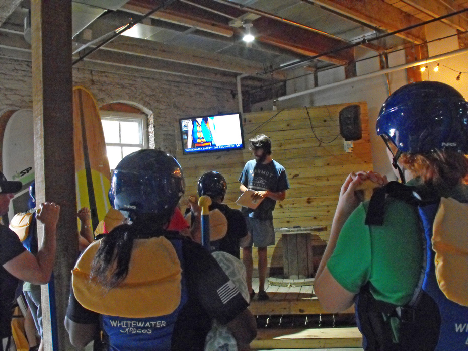 Instructor at rafting headquarters giving instructions