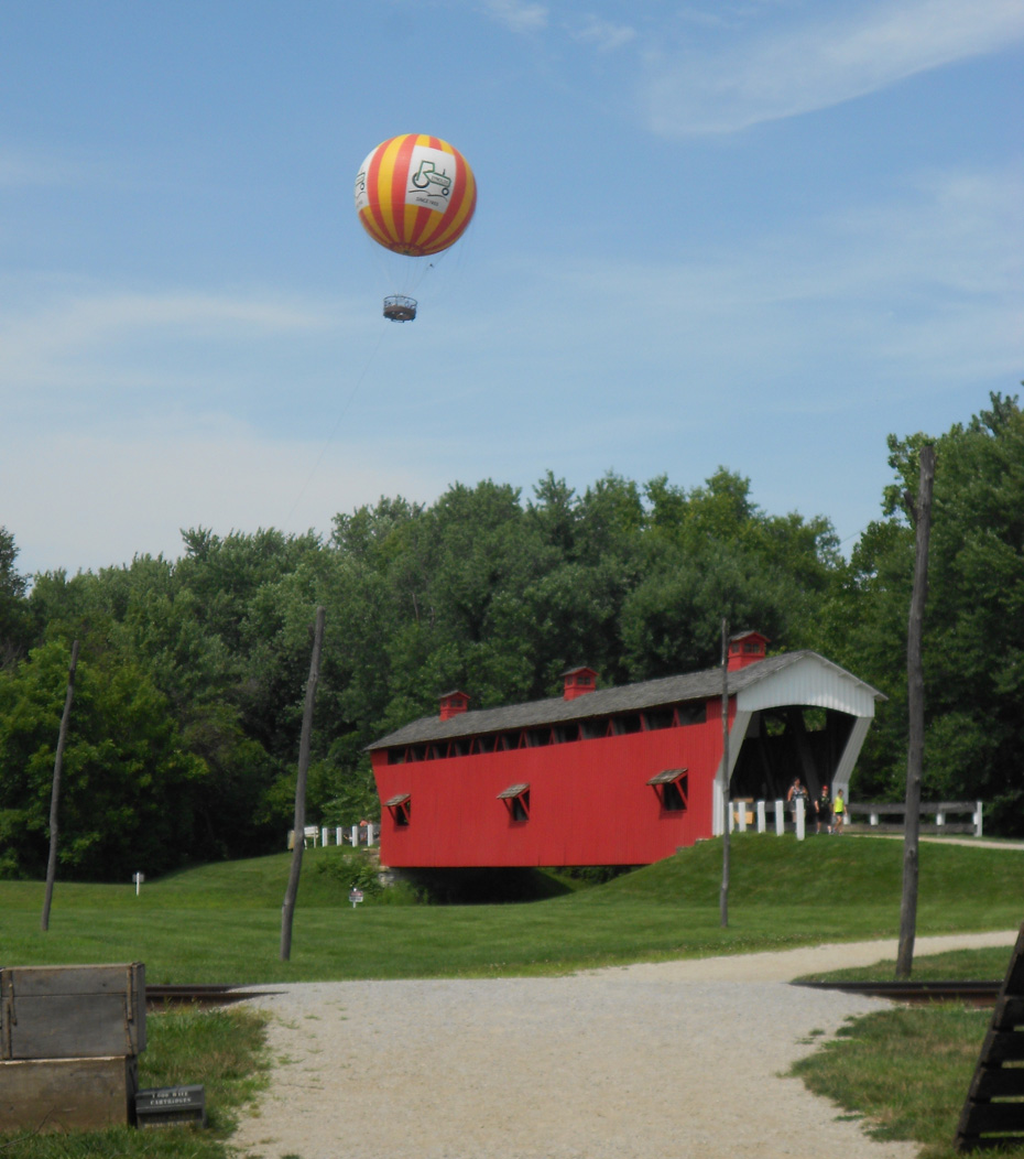 covered bridge with balloon overhead in Conner Prairie