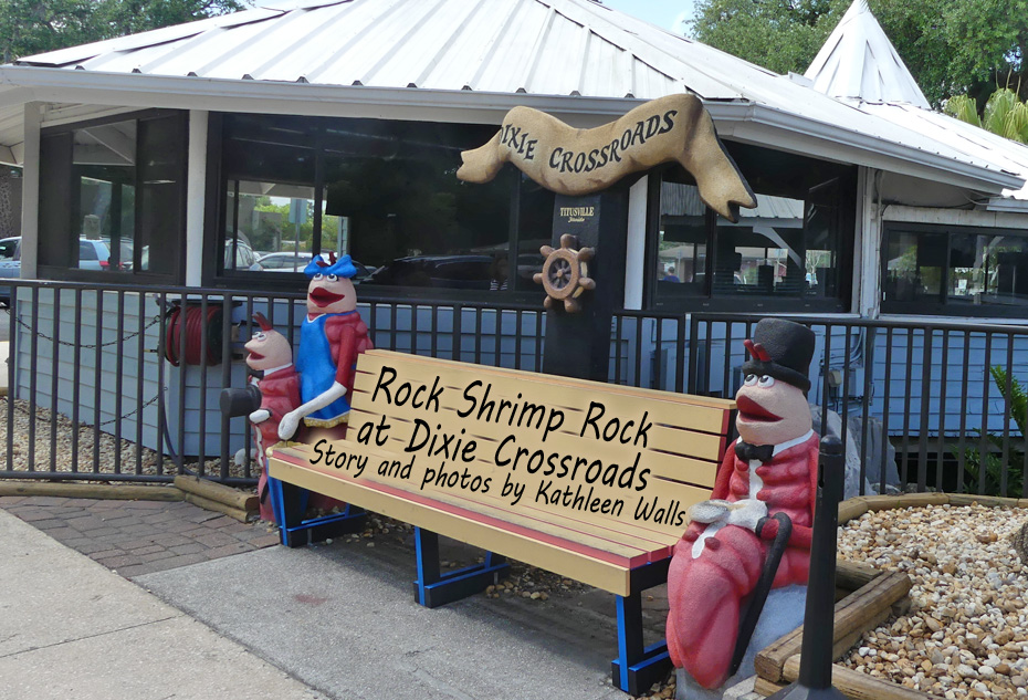 bench and rock shrimp statures ourside Dixie Crossroads