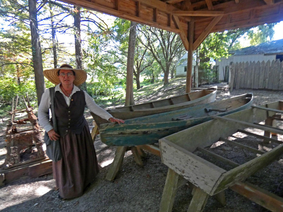 Our docent showing boats build by Cajuns