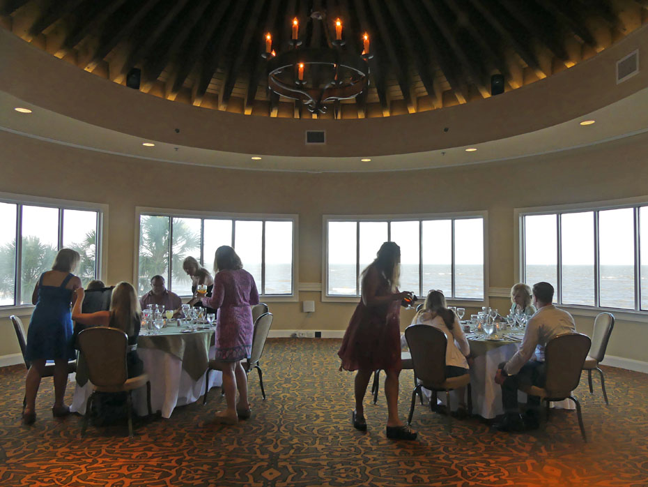 people seated at two tables in banquet room