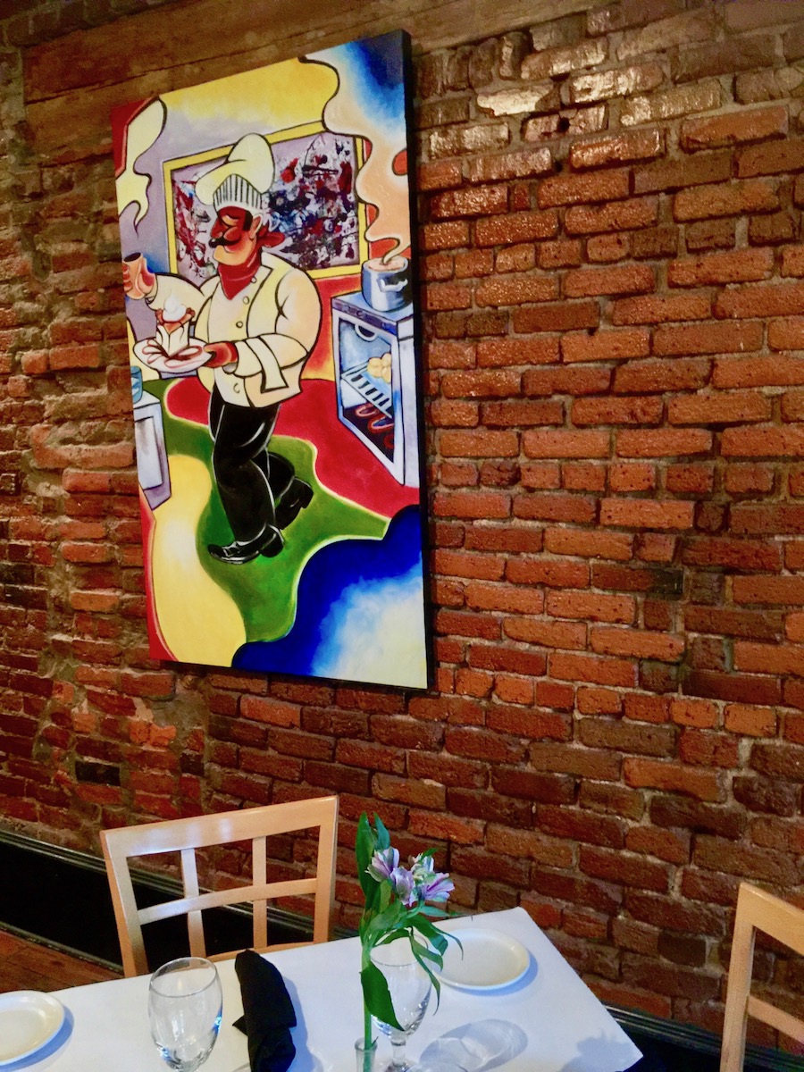 chef painting on brick wall in Valdosta GA