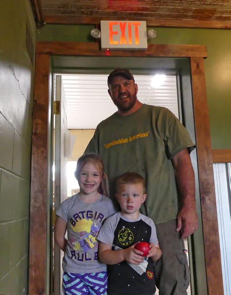 Owner and two children at Flying Buck Distillery