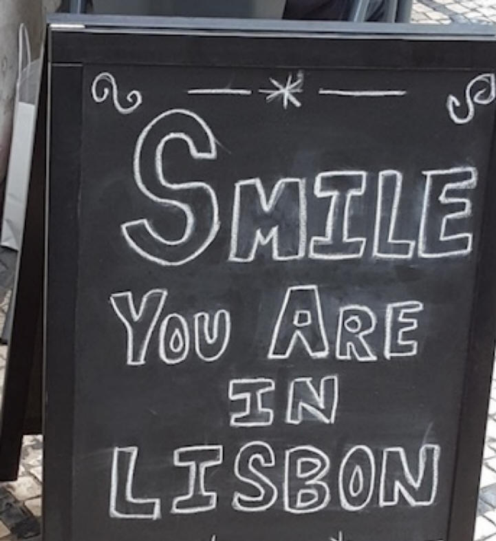 sign saying smile you are in Lisbon