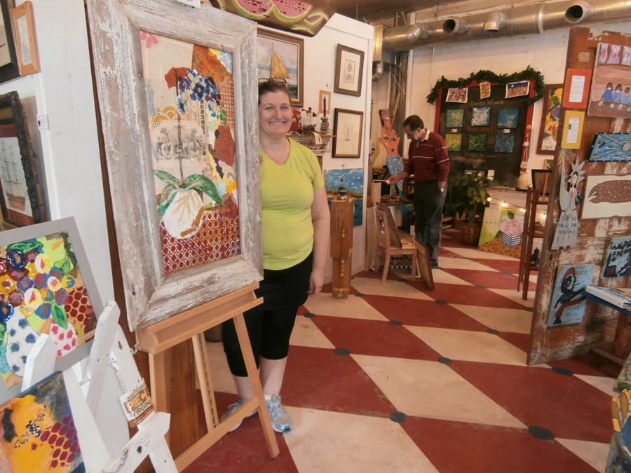 Owner showing her art in Colonial Folk Art Museum in Williamsburg, va