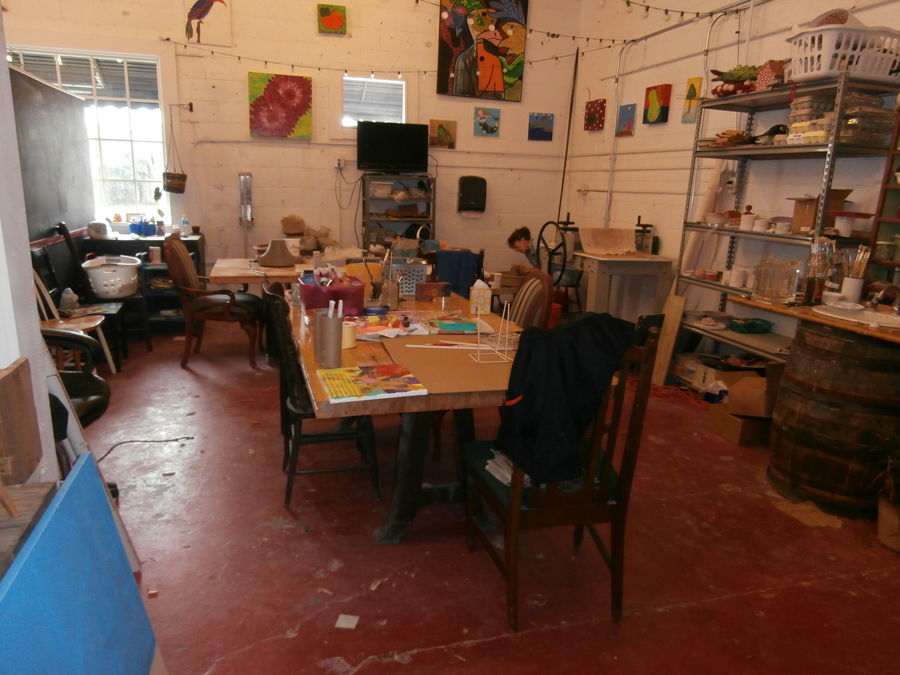 Colonial Folk Art Studio with 2 pottery wheels in the back in willaimsburg, Va