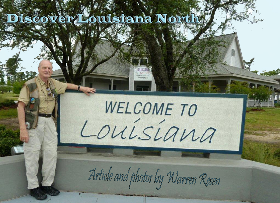 Man in fornt of LA CVB with welcome to Louisiana sign