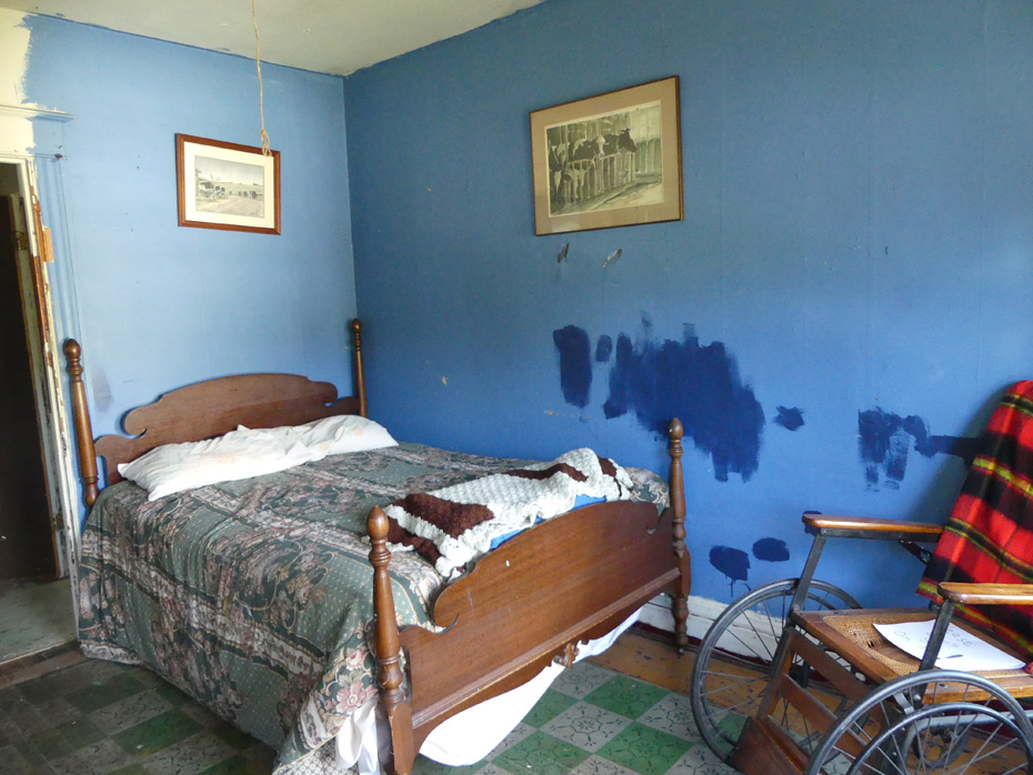 bed and wheelchair in haunted room